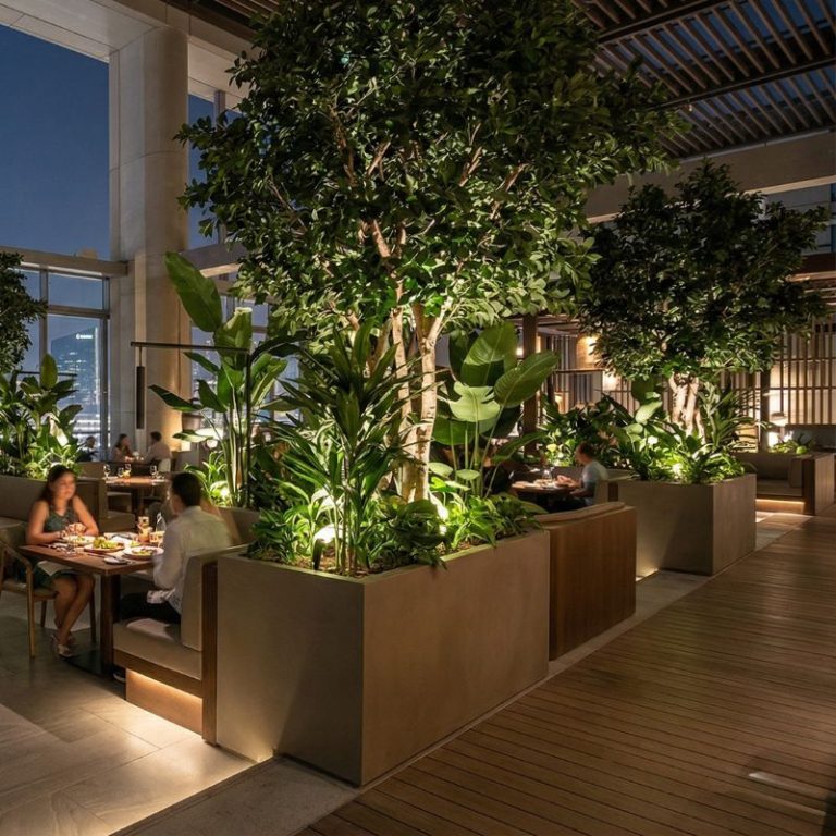 Commercial-planters-used-to-divide-seating-zones-in-restaurant-interior